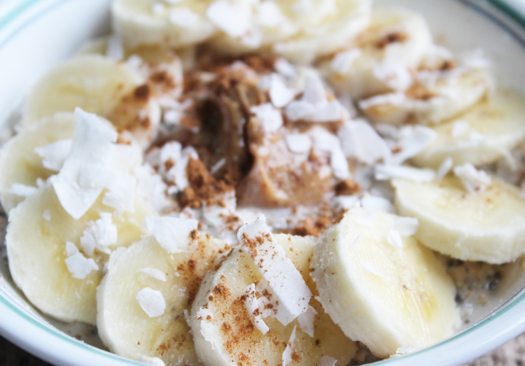 These peanut butter banana overnight oats are sprinkled with shredded coconut and cocoa powder