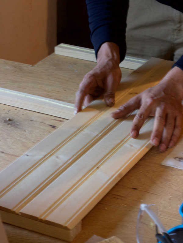Line the wood strips up on the glued pine boards