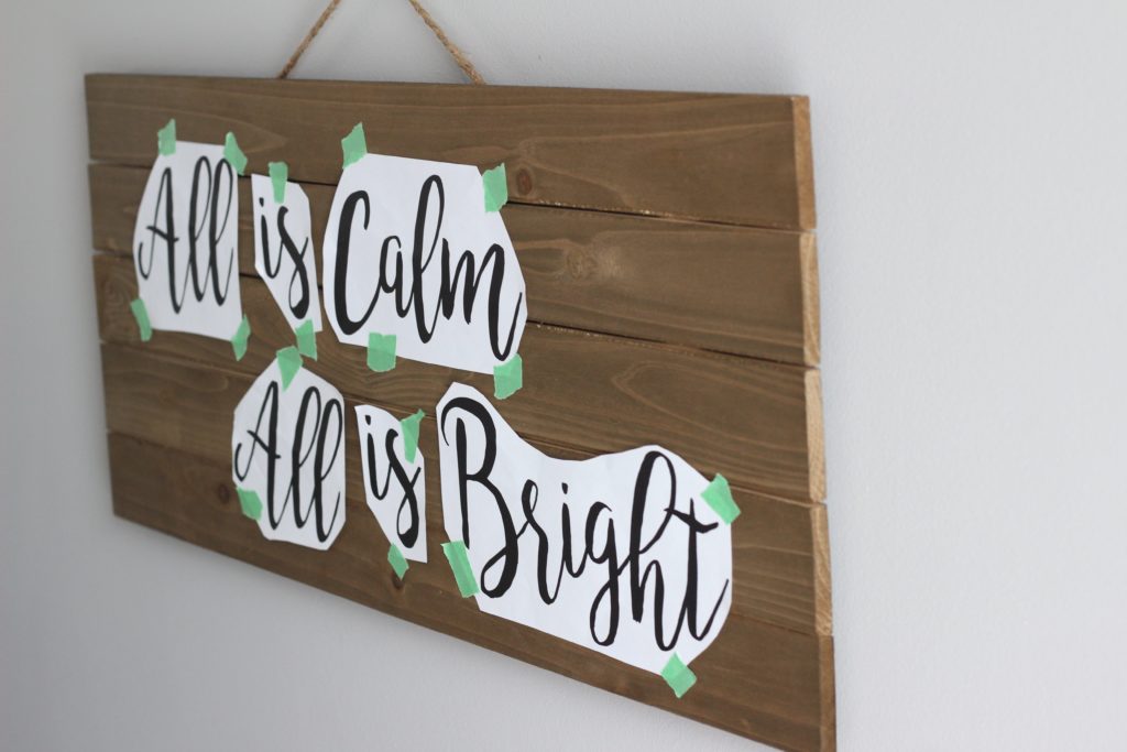 Make this simple Christmas lights sign using an easy paper stencil