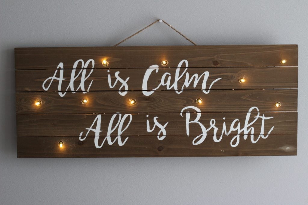 Lighten up your Christmas decor this year with this easy DIY Christmas lights sign!