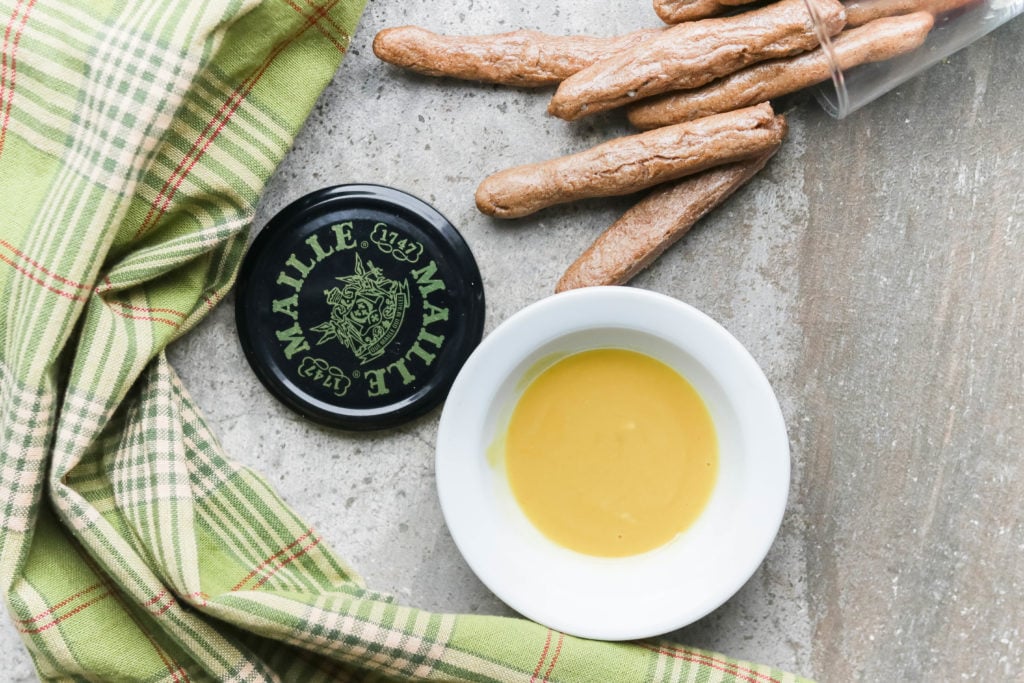 Gluten-free and vegan pretzel sticks paired with a sweet and tangy maple mustard dip