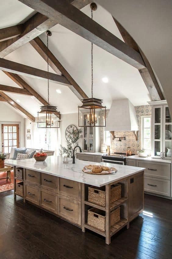 Tips for styling a farmhouse kitchen; rustic island, wood beams
