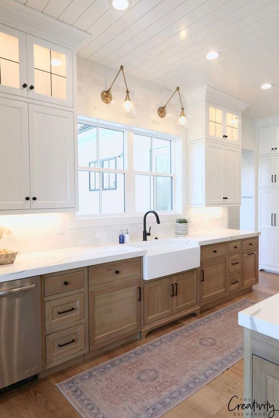 Tips for styling a farmhouse kitchen; lower wood cabinets, rustic cabinets, white farmhouse kitchen, white farmhouse sink, over window lights
