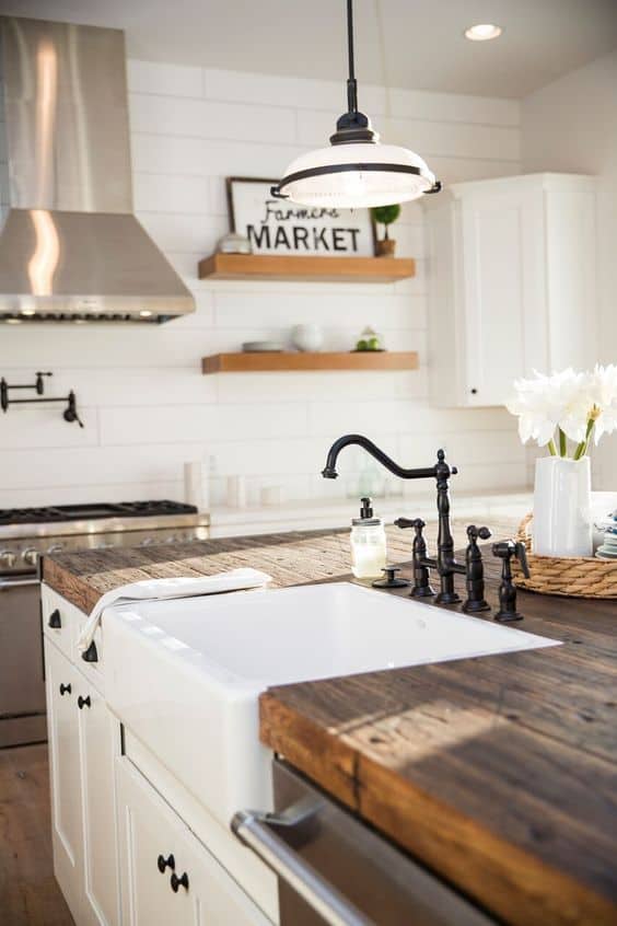 Tips for styling a farmhouse kitchen; wood countertops, rustic counters, kitchen wood counters, white farmhouse sink, open kitchen shelving