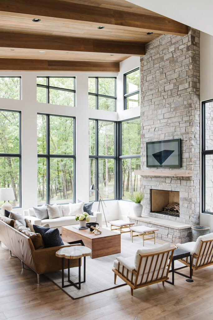 Studio Mcgee living room, large windows, stone fire place with tv