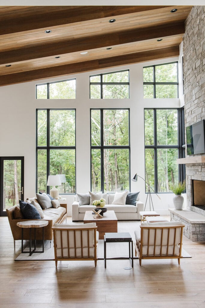 Studio Mcgee living room, large windows, stone fire place with tv