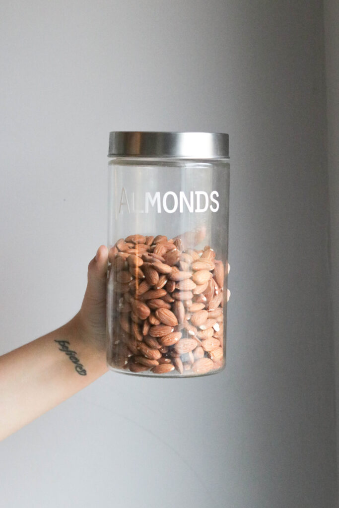 Pantry Organization with Large Labels;  almonds, clear jar, small jar, silver lid