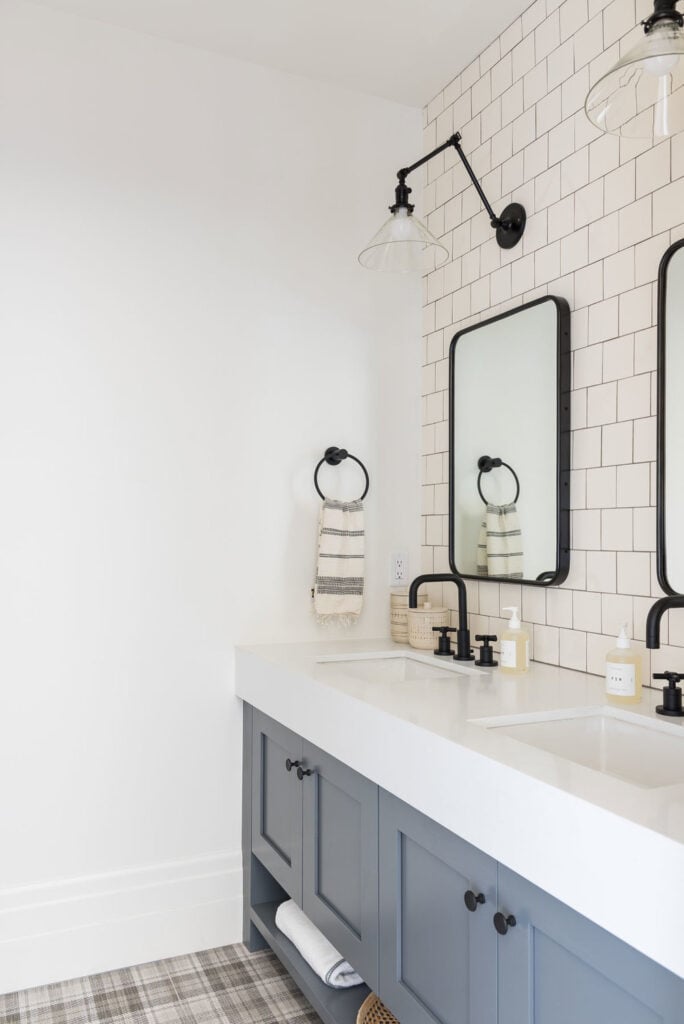 Bathrooms by Studio McGee; grey vanity, black accents, square black mirror, subway tile