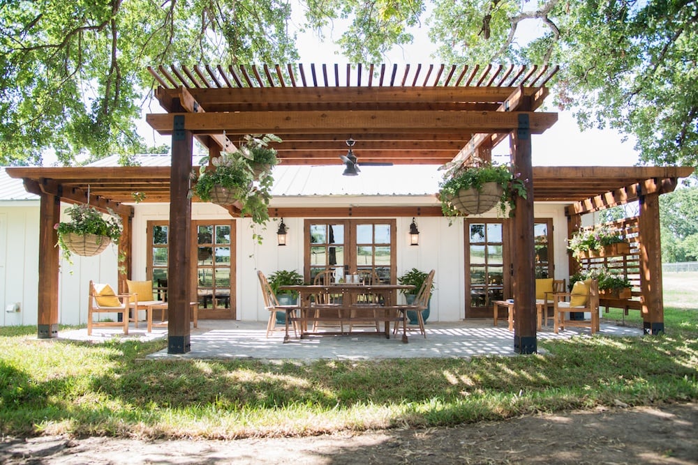 wood pergola - Top Outdoor Spaces by Joanna Gaines; best backyard, garden and patio areas redone by Joanna Gaines from Fixer Upper