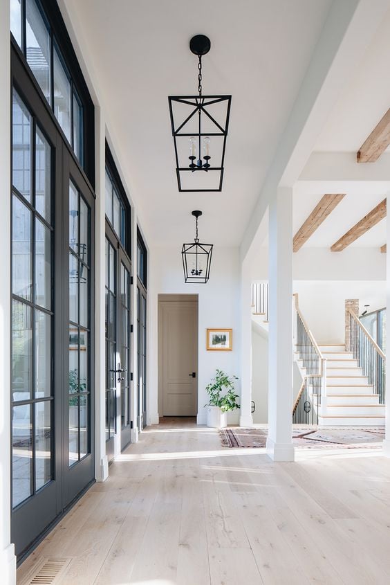 Modern Farmhouse Design Must haves: large windows, open concept, white, bright, chandelier 