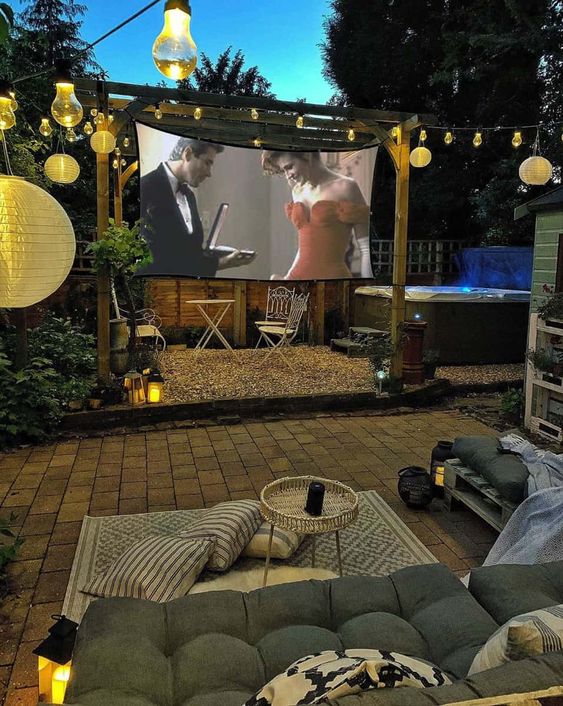 Tips for Styling your Deck this Summer; backyard movie screen, movie night outdoors, outdoor projector