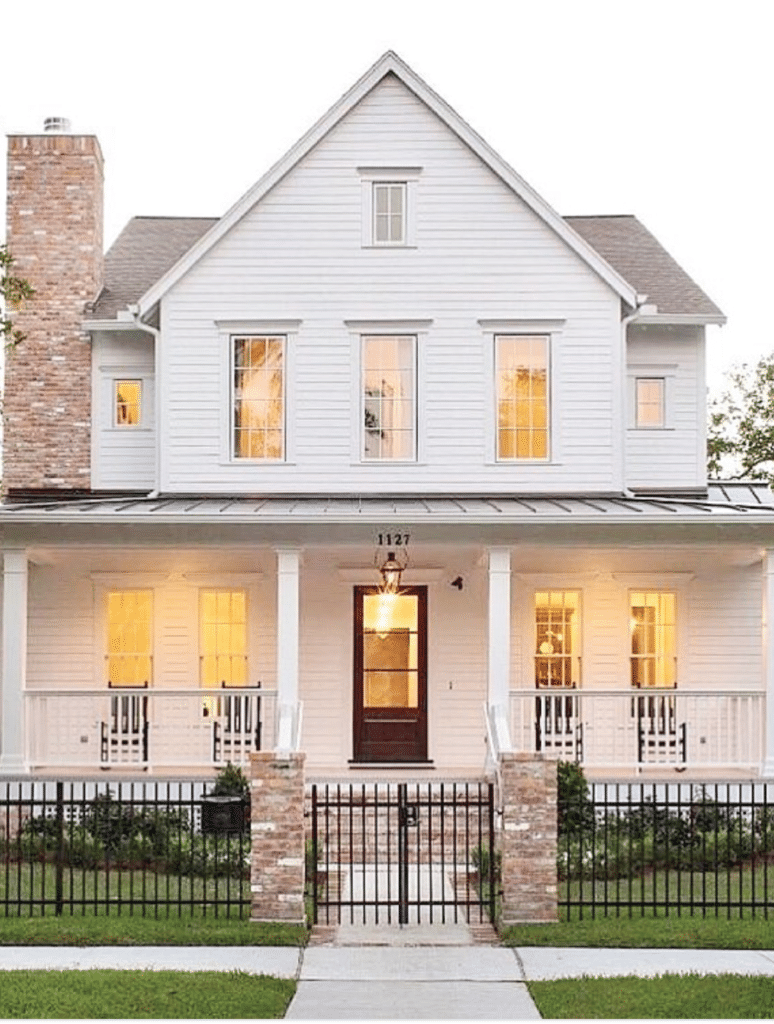 white modern farm house, black trim windows, large front porch, tall windows, symmetrical exterior