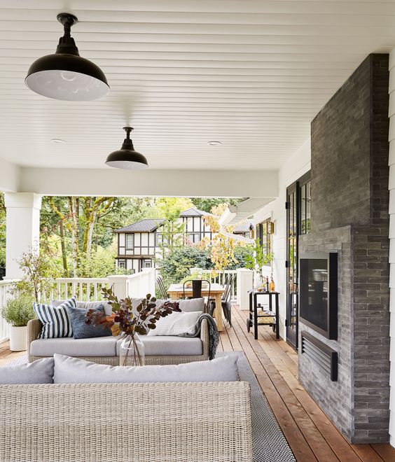 Tips for Styling your Deck this Summer; fireplace, wicker furniture, wicker outdoor furniture, living space