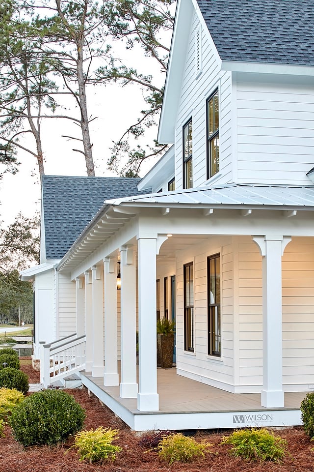 white modern farm house, black trim windows, large front porch
