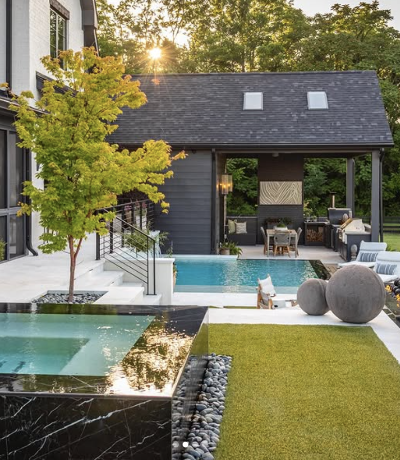 modern dark exterior pool house with covered patio lounge and backyard swimming pool