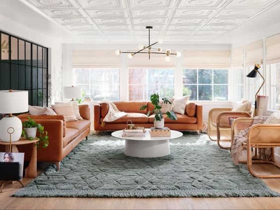 Best NEW Living Rooms by Joanna Gaines from Fixer Upper; leather couch, green, girly, pink, modern farmhouse