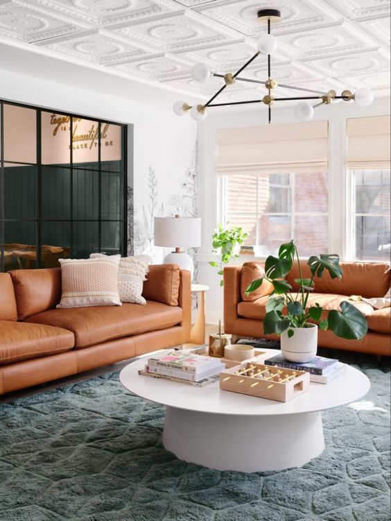 Best NEW Living Rooms by Joanna Gaines from Fixer Upper; leather couch, green, girly, pink, modern farmhouse