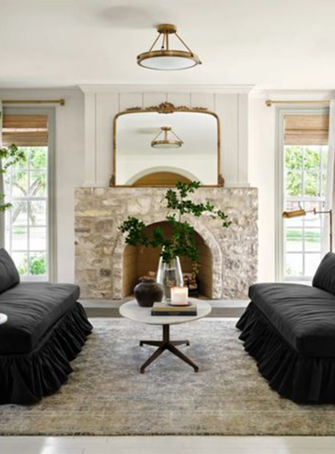 Best NEW Living Rooms by Joanna Gaines from Fixer Upper;  stone fireplace, black couch, anthropologie mirror