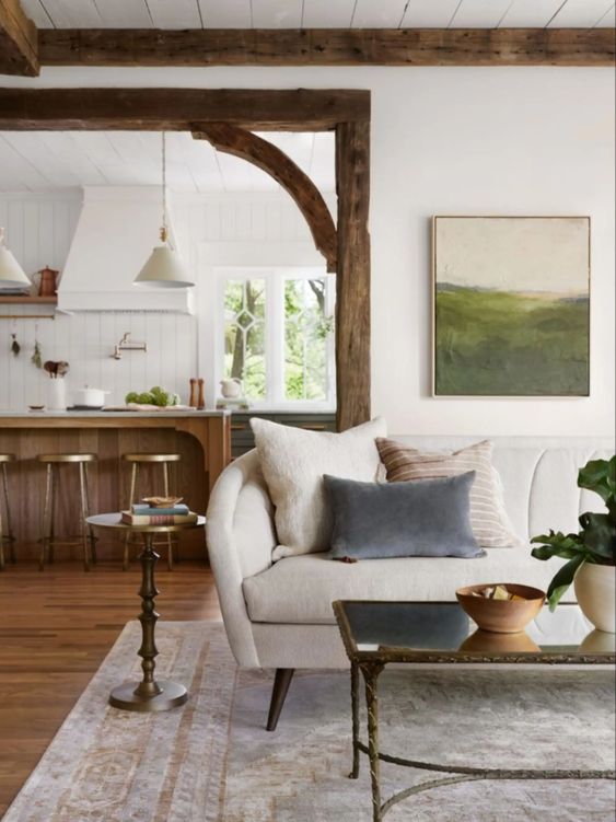 Best NEW Living Rooms by Joanna Gaines from Fixer Upper; wood beams, white couch, farmhouse