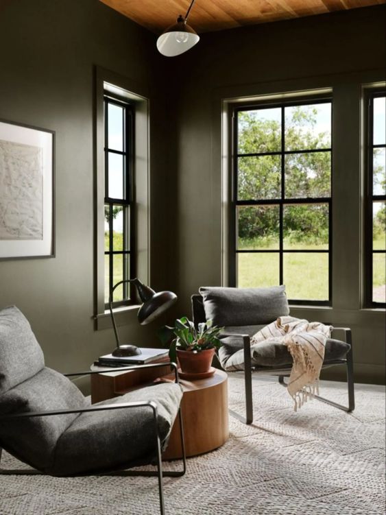 Best NEW Living Rooms by Joanna Gaines from Fixer Upper; moody seating area, dark chairs, reading area