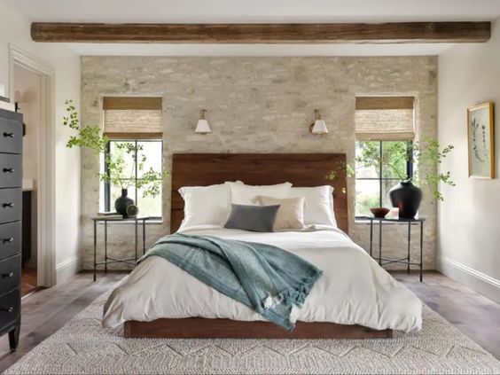 Best NEW bedrooms by Joanna Gaines from Fixer Upper; med bedroom, wood beams, dark wood bed 