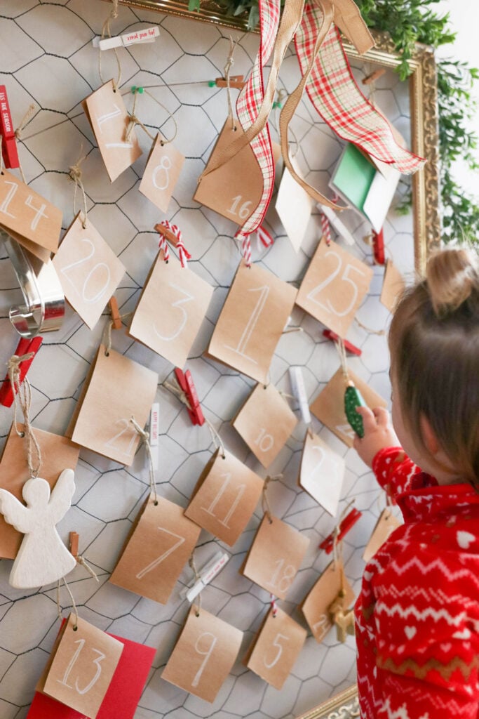 Our Christmas Activity Advent Calendar; everyday until Christmas, our toddler will open a hanging card to see what fun Christmas activity or adventure we will be doing that day! Chocolate free advent calendar idea!