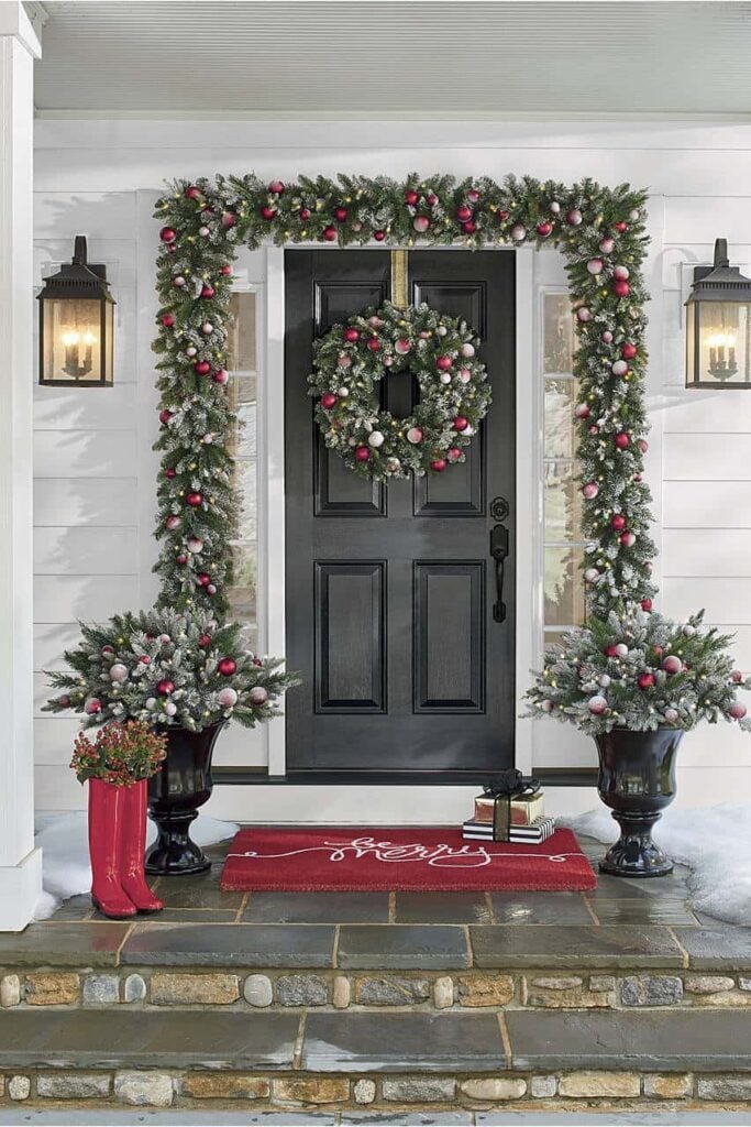 Simple Christmas Front Porch Decor Ideas; christmas front porch, christmas front door, front door decoration, garland, door garland, front door garland, red mat, red welcome mat, ornaments around front door