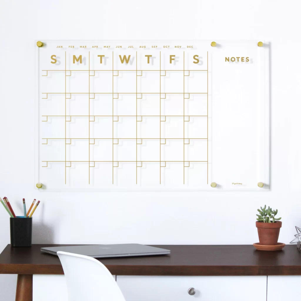 Gold Acrylic Wall Calendar - 15 Pretty Home Office Must Haves to Boost Style and Productivity; When it comes to home office design, the right tools for the job are essential. Here are 15 pretty must have items to help you stay organized, productive and stylish.