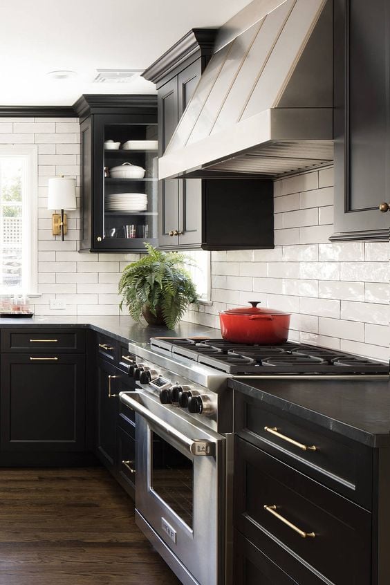 15 Beautiful Black Kitchens That Will Make You Want to Move to the Dark Side; Dark and moody kitchen designs, black kitchen cabinets, dark countertops and black kitchen design inspiration 