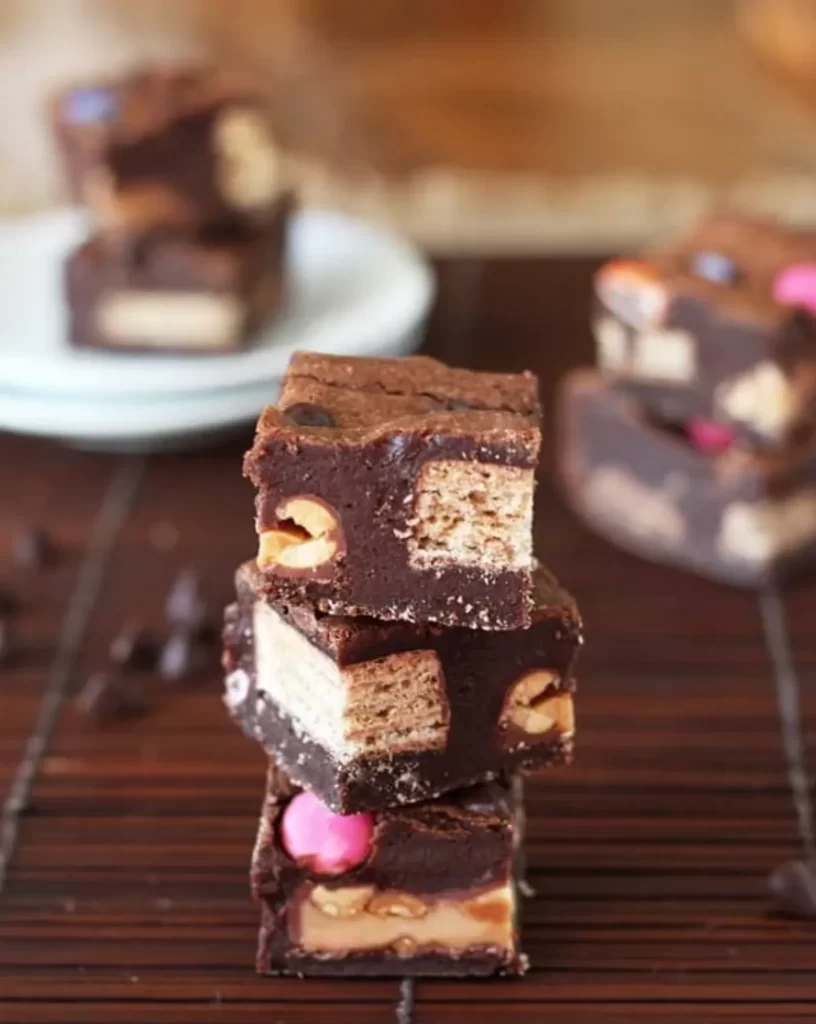 Leftover Candy Stuffed Brownies - 25 Creative Leftover Mini Eggs Recipes to Try This Easter; delicious and sweet recipes using extra Cadbury mini eggs - Baked goods, sweets, and cakes!