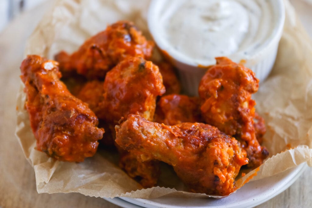 Garlic Buffalo Chicken Wings - These buffalo chicken wings pack quite a bit of garlic punch. They're spicy, but if you're a garlic lover, this easy appetizer recipe is for you.