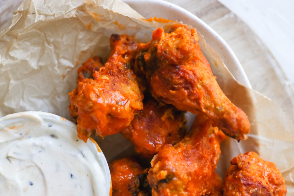 Garlic Buffalo Chicken Wings - These buffalo chicken wings pack quite a bit of garlic punch. They're spicy, but if you're a garlic lover, this easy appetizer recipe is for you.