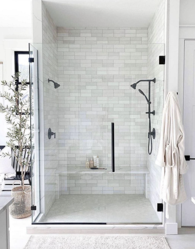 Shower with black hardware - 27 Genius Home Energy Saving Tips; Want to save energy and cut costs? See these simple tips to lower your utility bills. Learn more about saving energy at home here.