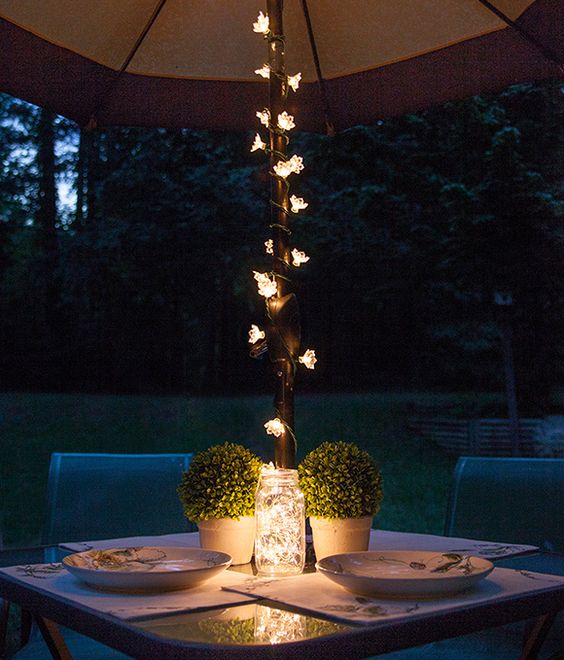 Patio lights string ideas; Transform your outdoor area into an entertaining hub with these 27 light string patio ideas. lights on umbrella outdoor