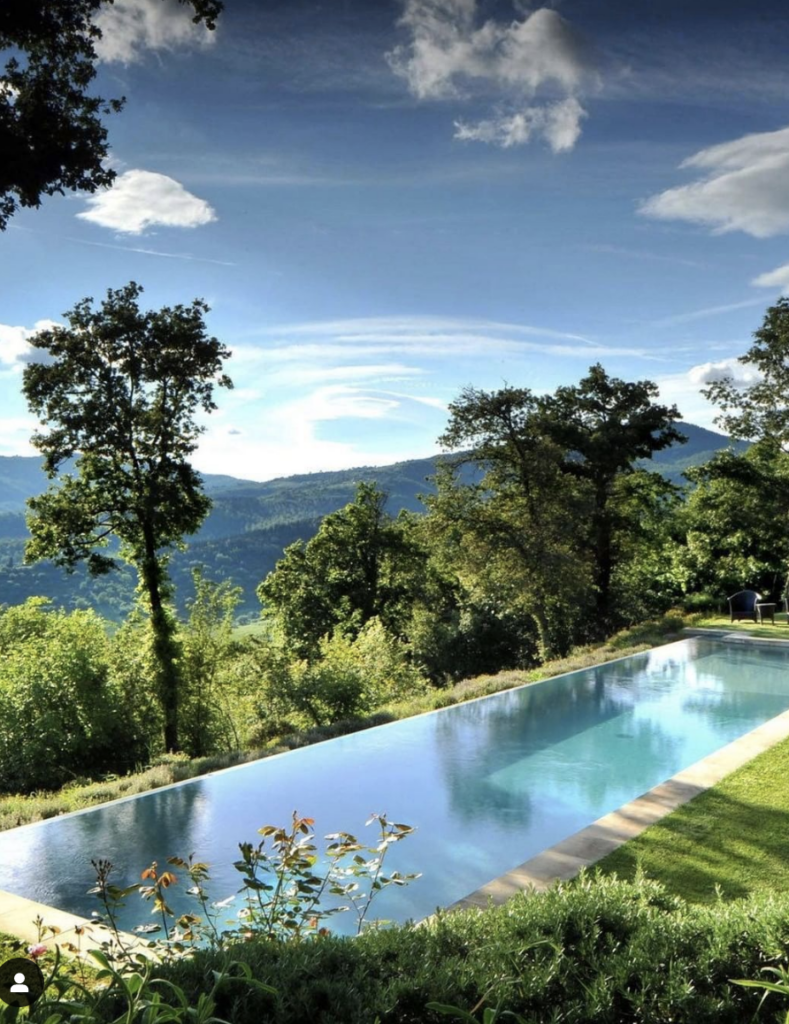 Infinity pool; Beautiful Hillside Pool Ideas with Retaining Walls; pools on hill design with masonry stone retraining wall ideas.