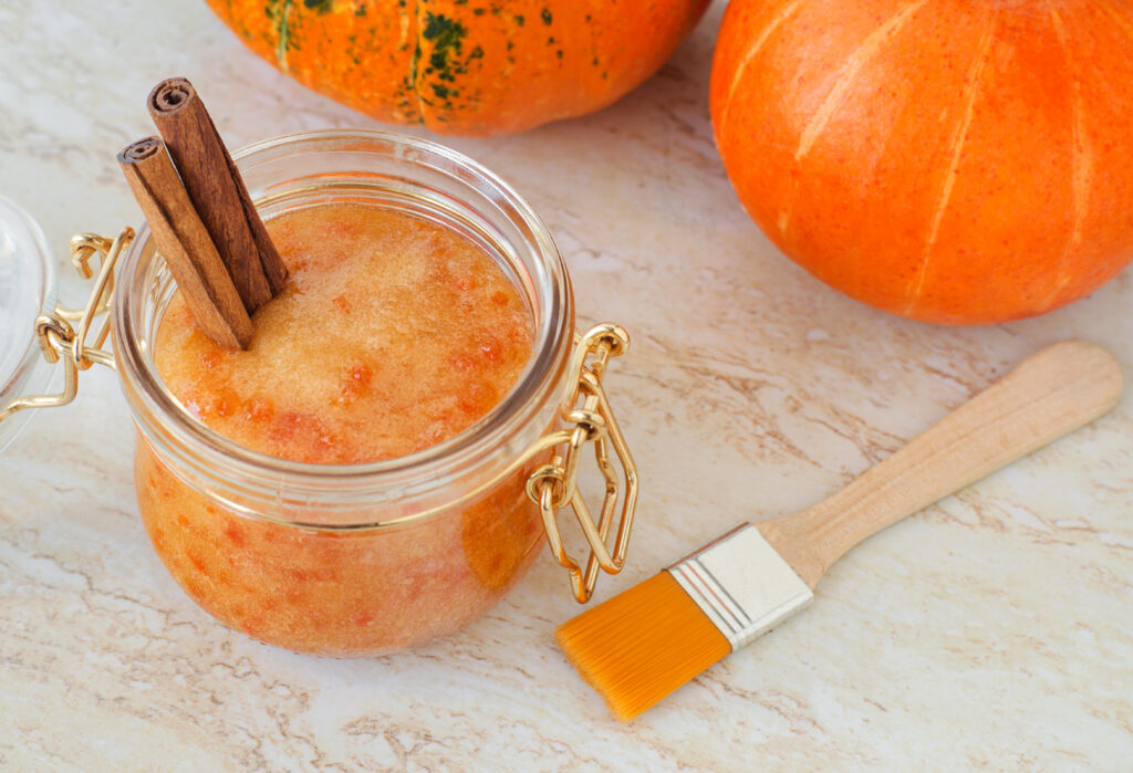 DIY Pumpkin Spice Sugar Scrub; This pumpkin sugar scrub is perfect for fall weather. Keeps your skin feeling soft and fresh with only a few natural ingredients! Easy homemade body product!