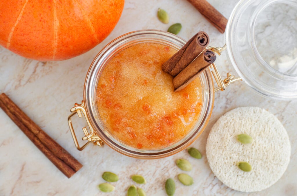 DIY Pumpkin Spice Sugar Scrub; This pumpkin sugar scrub is perfect for fall weather. Keeps your skin feeling soft and fresh with only a few natural ingredients! Easy homemade body product!