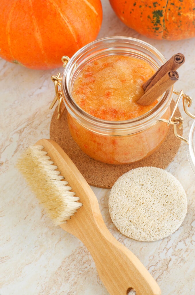 DIY Pumpkin Spice Sugar Scrub; This pumpkin sugar scrub is perfect for fall weather. Keeps your skin feeling soft and fresh with only a few natural ingredients! Easy homemade body product!