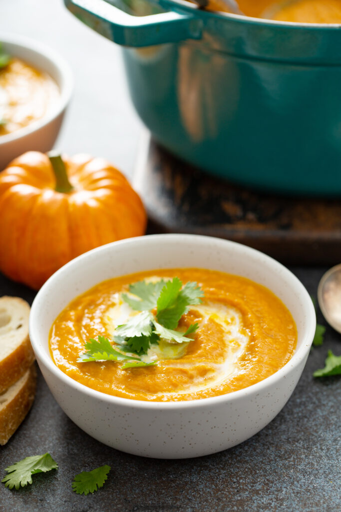 Thai Pumpkin and Carrot Soup Recipe; delicious 4 ingredient homemade soup recipe with thai curry, pumpkin, carrots and coconut milk! Vegan, dairy free, gluten free! Perfect Fall Recipe.