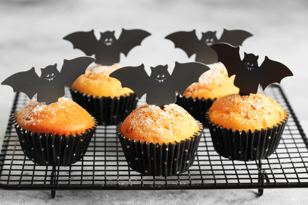 Halloween Bat Pumpkin Muffins; a cute festive halloween muffin recipe with cardboard bat top. Spooky halloween muffins!