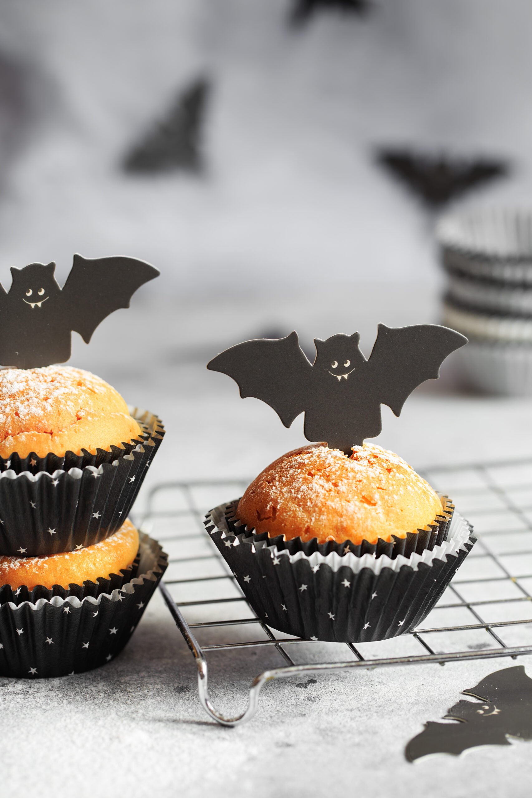 Halloween Bat Pumpkin Muffins; a cute festive halloween muffin recipe with cardboard bat top. Spooky halloween muffins!