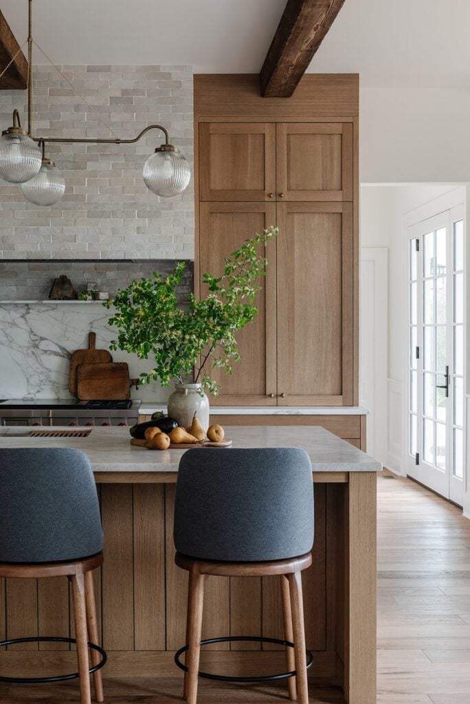 19 Genius Kitchen Design Must Haves; wood cabinets, marble counters, marble back splash