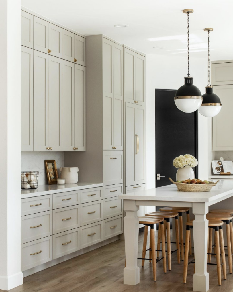 built in kitchen cabinets, mint cabinets, bulb pendant lights, wood stools