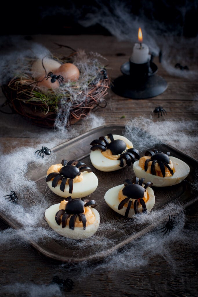 Halloween Spider Deviled Eggs; a fun and easy Halloween appetizer or snack made with eggs, mayonnaise and black olives! These are nut free, gluten free and can be dairy free!