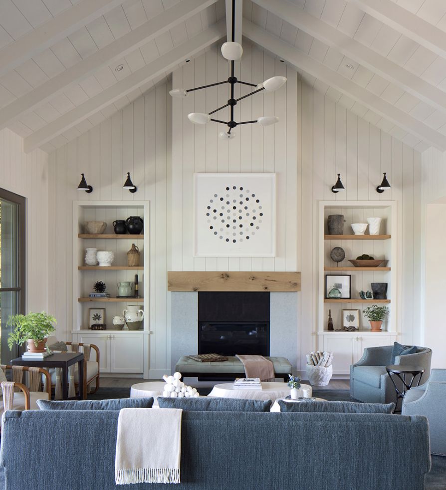 Cottage open concept dark wood floor, brown floor, vaulted ceiling and shiplap wall living room photo in San Francisco with white walls and a standard fireplace