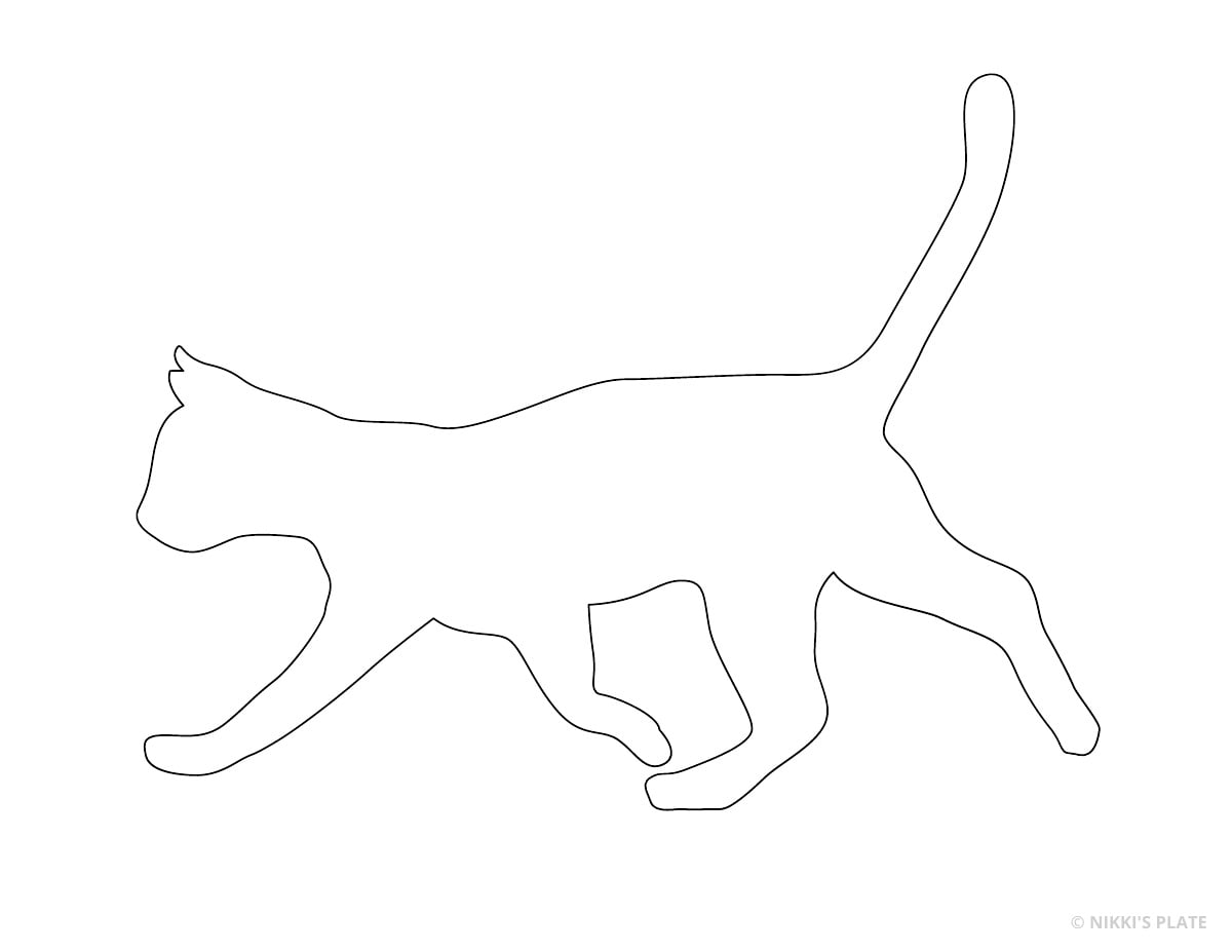 Walking cat with its tail raised printable pumpkin stencil outline.