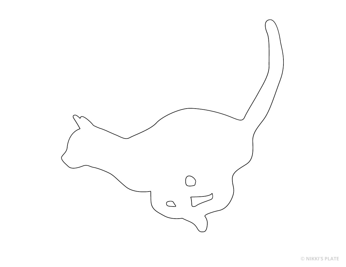 Playful kitten bending forward printable pumpkin carving pattern.
