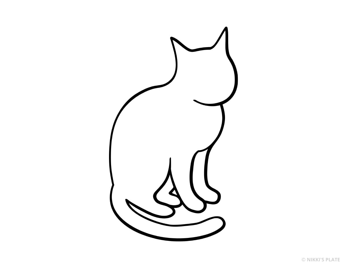 Seated cat with its tail wrapped around its paws printable pumpkin stencil.