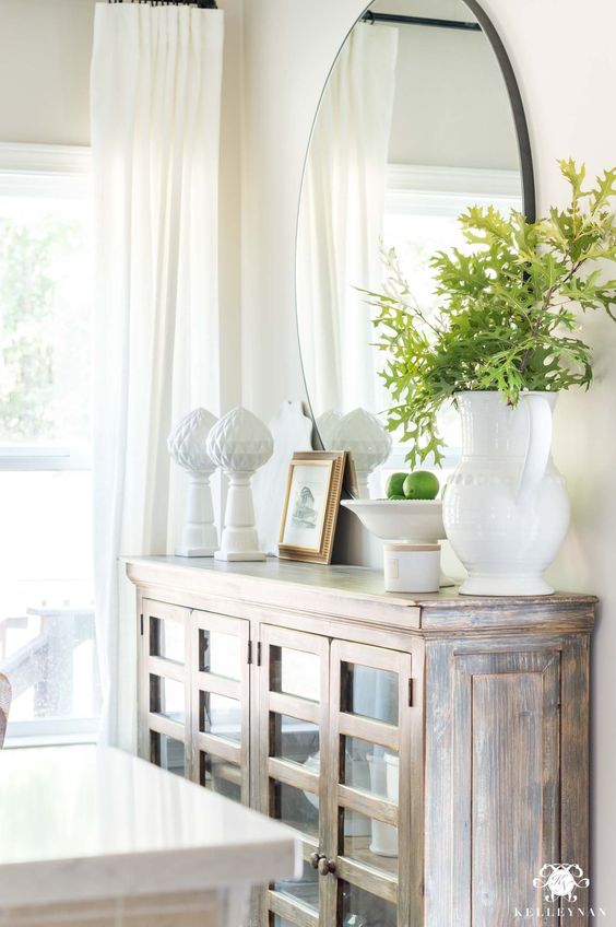 Tips to style a dining room buffet to make it the center piece in your dining room! Get creative with these buffet design ideas!