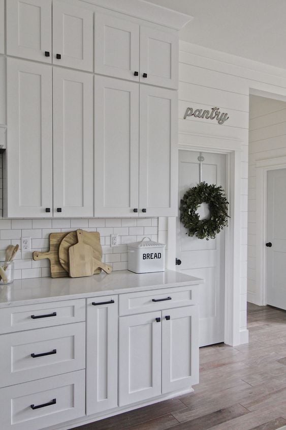 White Cabinets with Black Hardware Kitchen Ideas; white kitchen cabinets with black hardware for a beautifully classic farmhouse kitchen or modern kitchen look. 